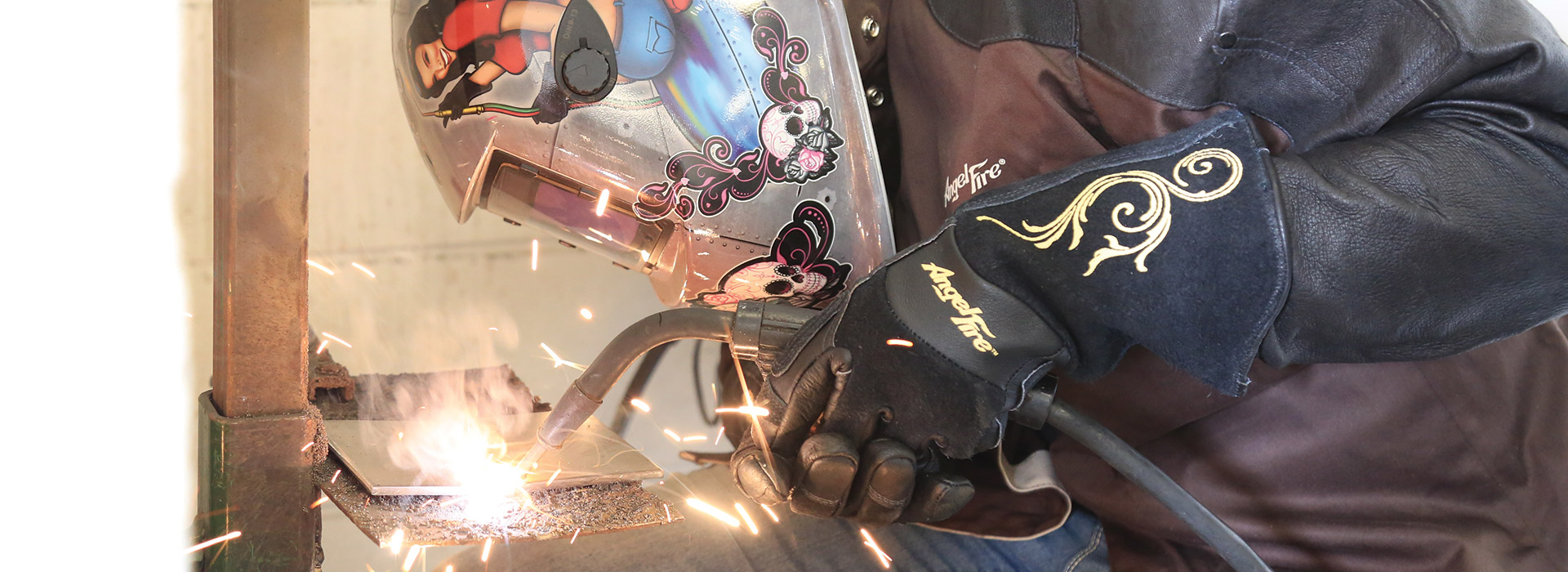 An automotive student practices welding