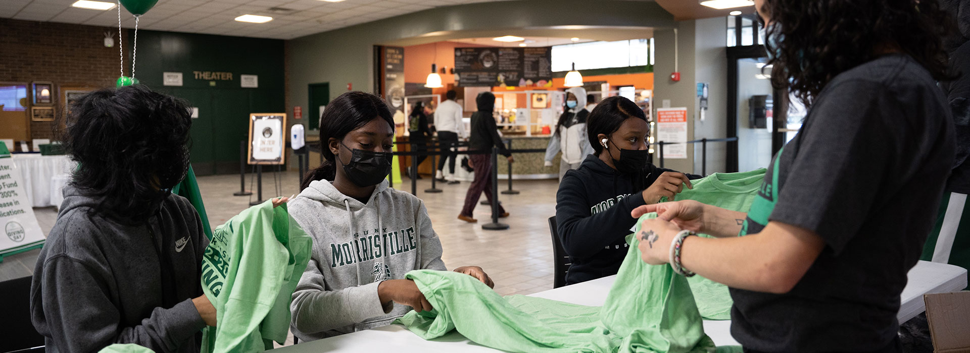 Students upcycle t-shirts to make Morrisville-themed bags.