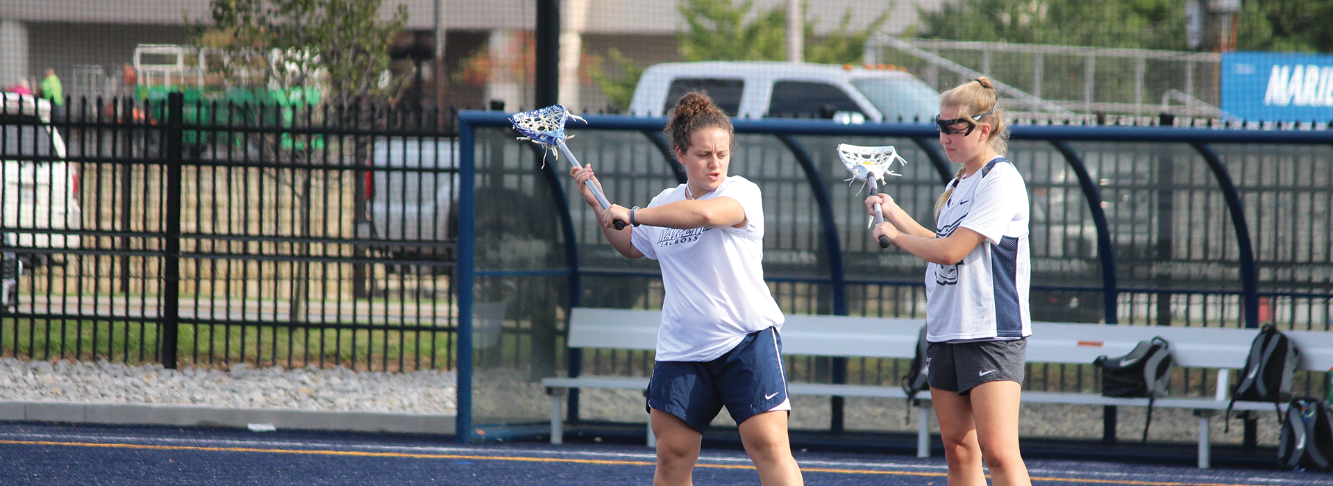 Jordan Anderson ’17 provides a few pointers as the assistant women’s lacrosse coach for Marietta College. Photo courtesy of Jeffrey Schaly, Marietta College
