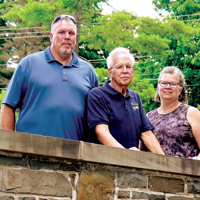 George (center) with his son, Jason, and daughter, Trudi. 