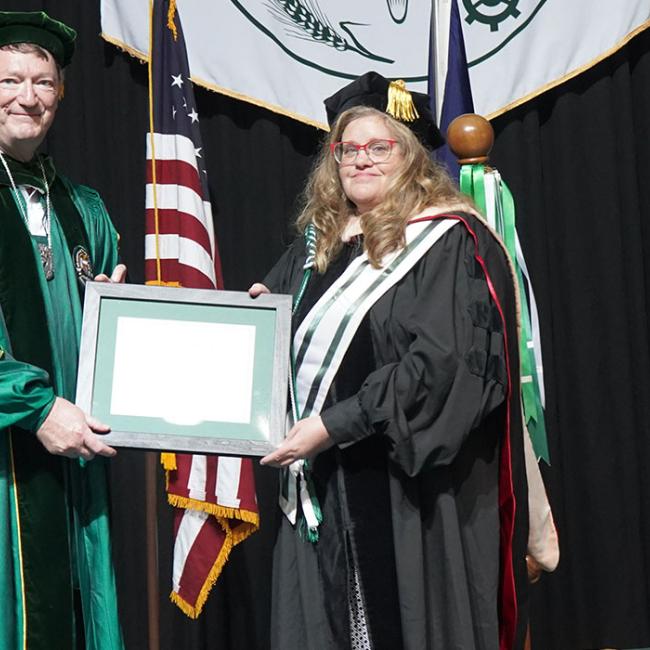 Sheila Marshman receives her award.