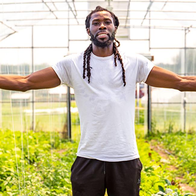 Tweh Johnson in the green house