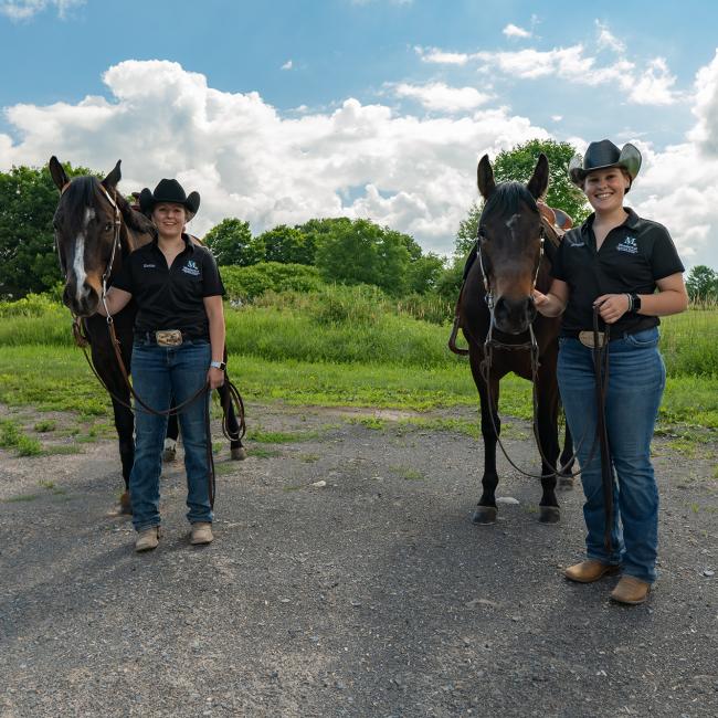 Horses who once relied on classes of students for their care, learned to rely on unheralded equine students and dedicated faculty and staff to keep them going during the COVID-19 quarantine, including Kaitlin Renschen, left, with Donald, and Kendalle Booth with Wilma.