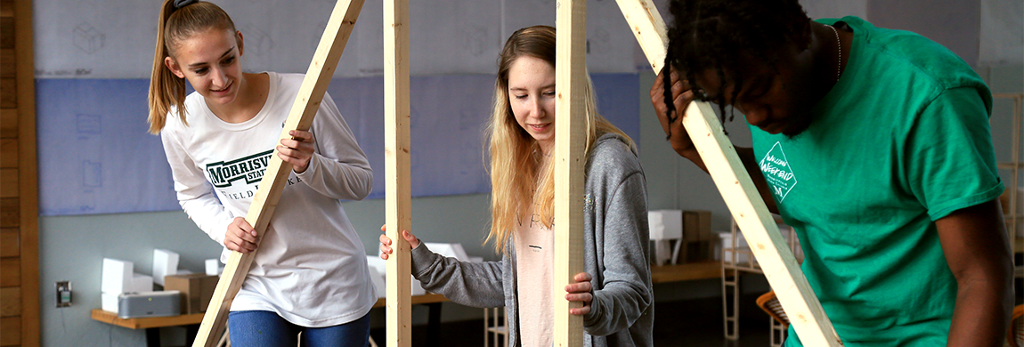 Architechture students building a model