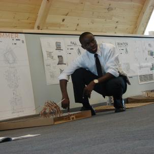 An Architectural Studies and Design student presents his final design project during a final critique. 